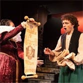 Production of Something Rotten featuring Nick Bottom gasping at scroll showing Shakespeare is producing Richard III	